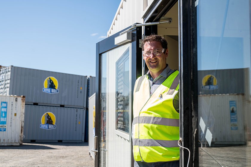 Royal Wolf Business Development Manager (Tasmania) Michael Nicholson is thrilled to be part of the project putting a roof over the heads of those who need it most. Photo: Alastair Bett